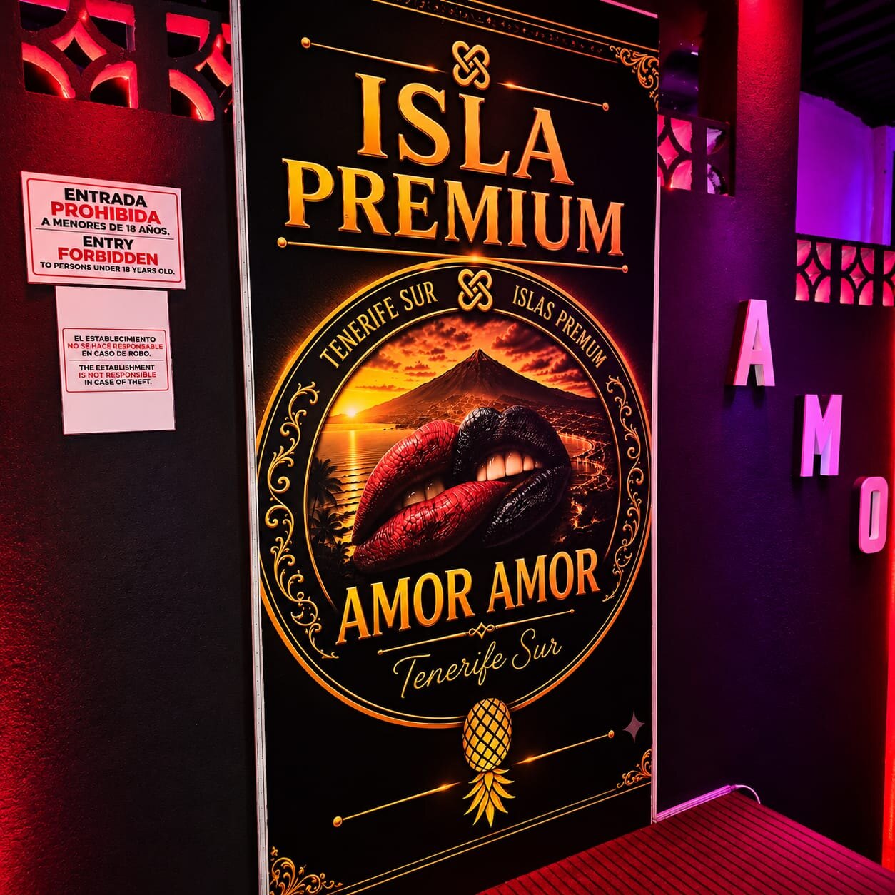Club entrance with Isla Premium Amor Amor poster