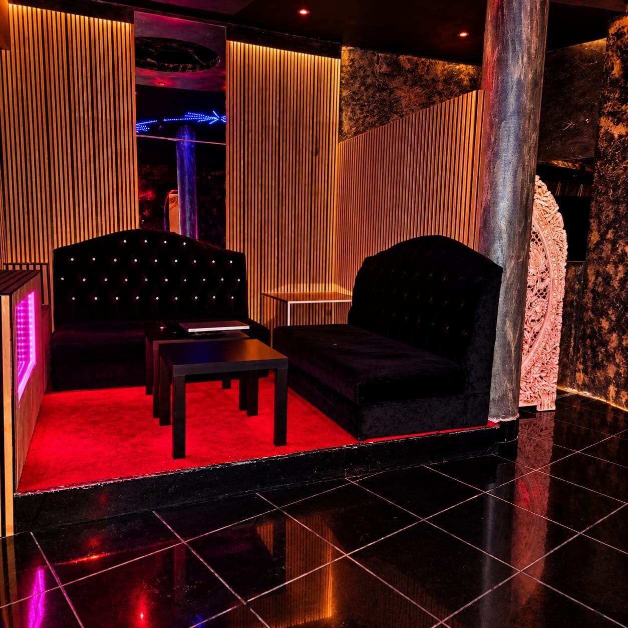 VIP booth with black velvet sofas