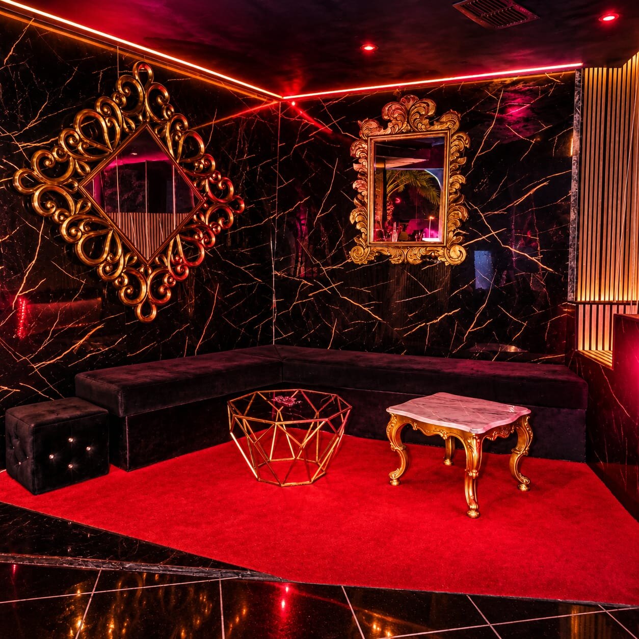 Black marble lounge with gold mirrors