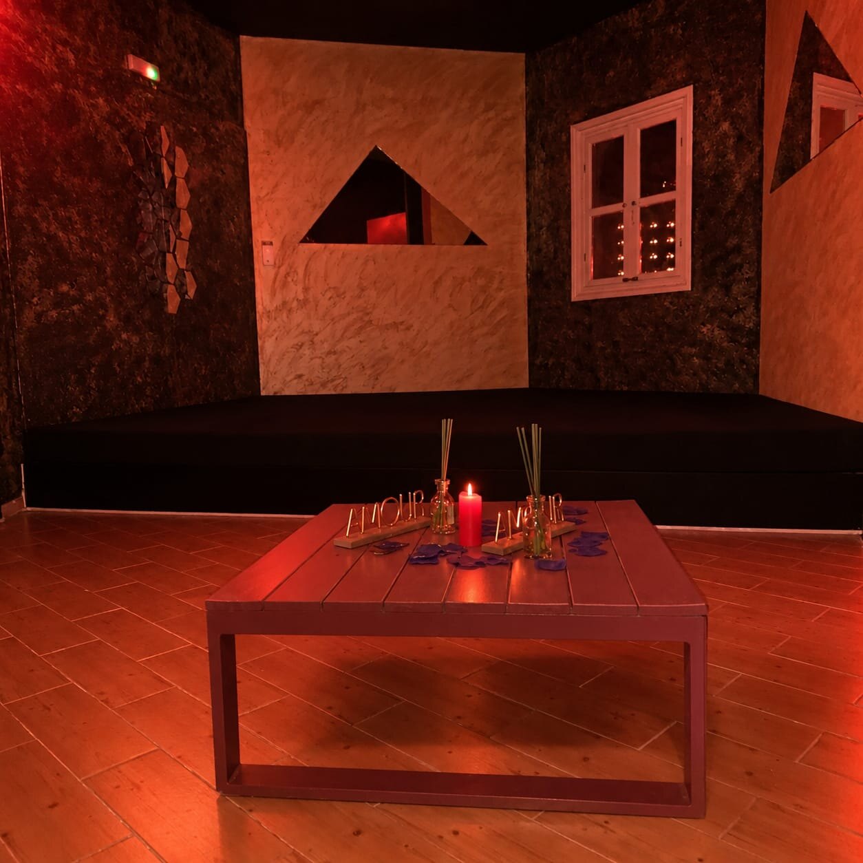 Candlelit room with surrounding seating
