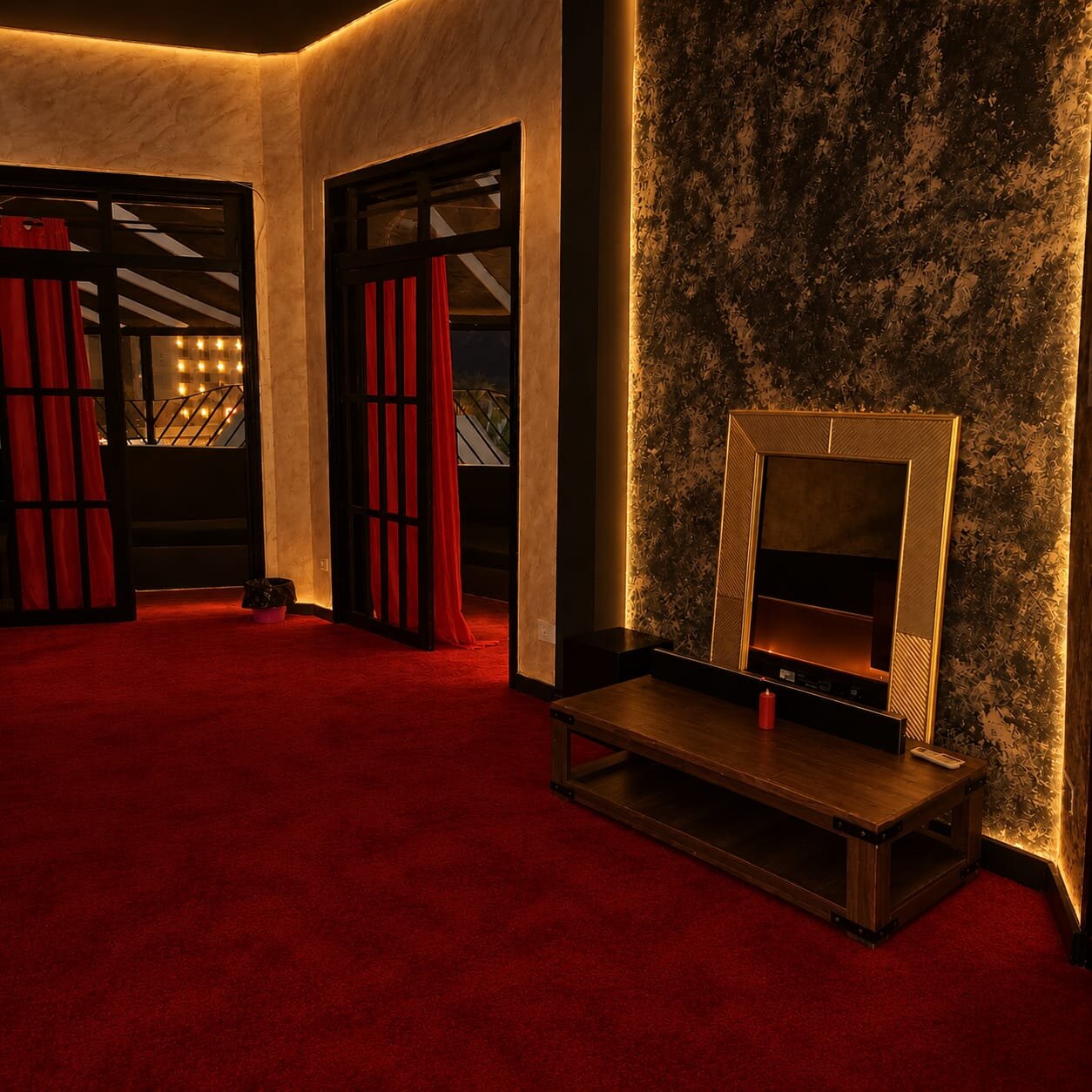Suite with fireplace and red carpet