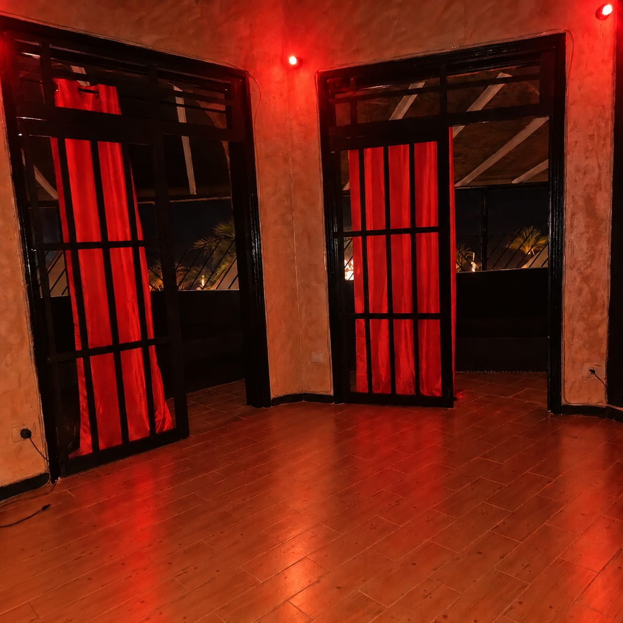 Private room with red-curtained doors